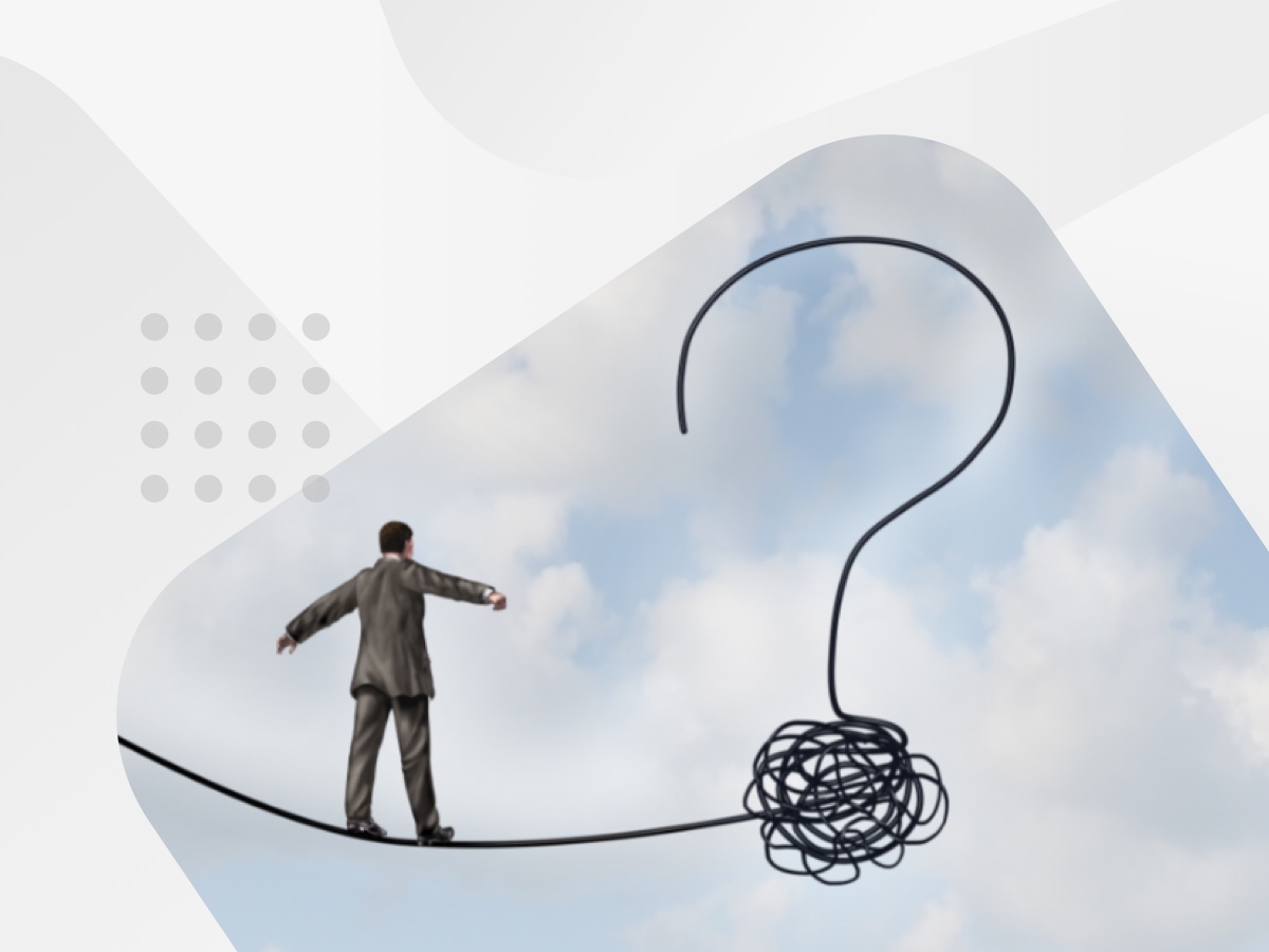 Business man walking along a rope
