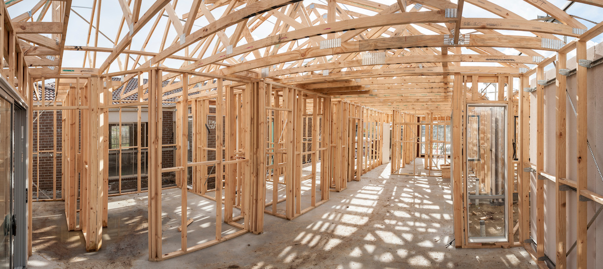 Panoramic interior view of a wooden timber frame from a new house under construction