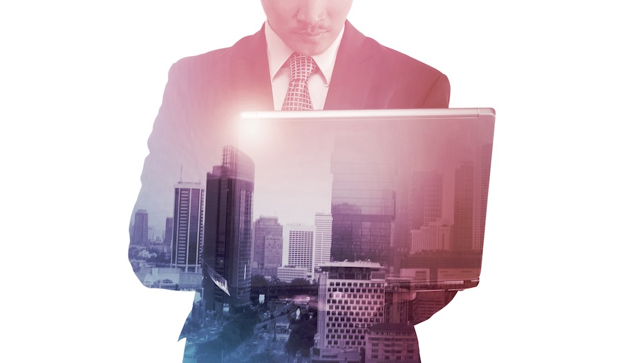 Business man with multiple exposure holding tablet computer