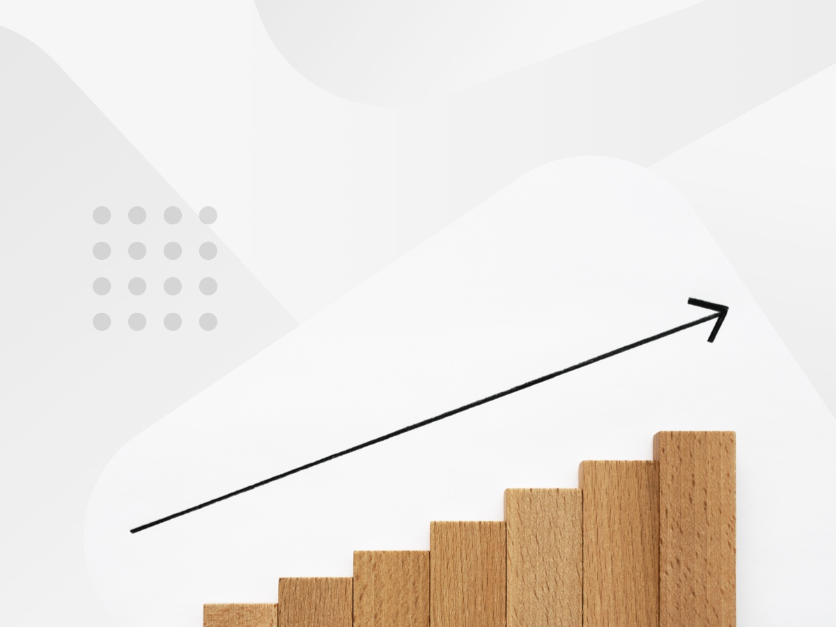 Arrow pointing up on wooden staircase.